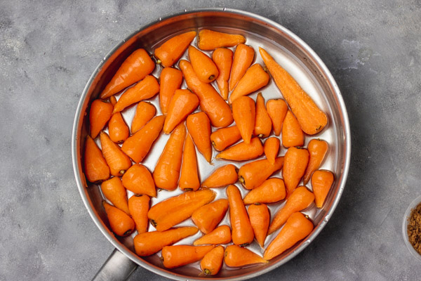 carrots about to be simmered on the stovetop.
