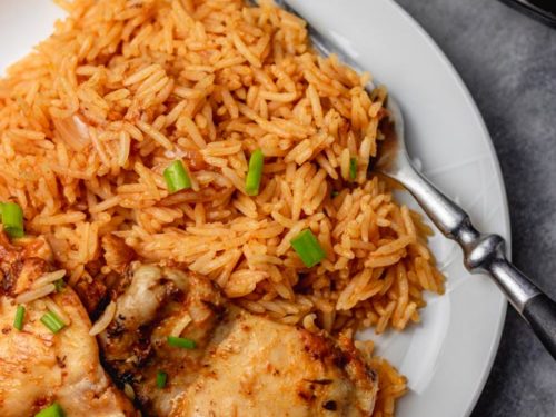 pressure cooker rice and chicken served on a plate.