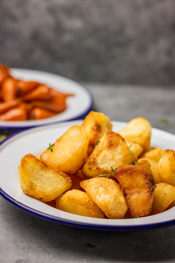 crunchy and crispy roast potatoes in a plate.