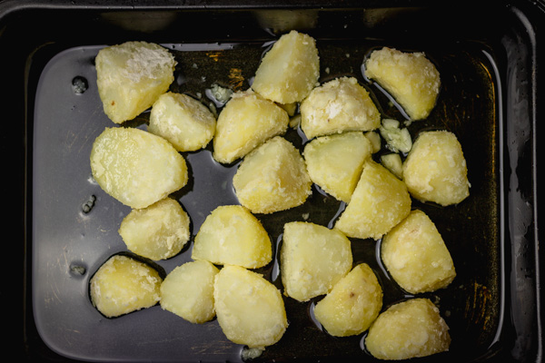 potatoes in hot olive oil about to put in the oven.
