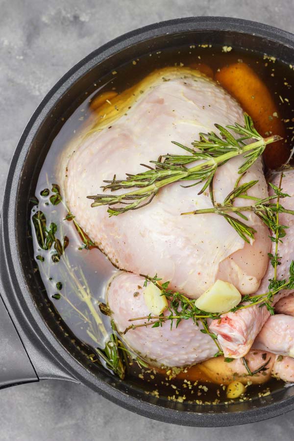 How to brine a whole chicken with saltwater, sugar and herbs.