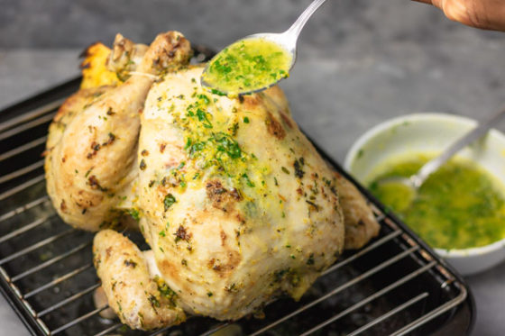 how to spoon herb butter on partially roasted chicken.