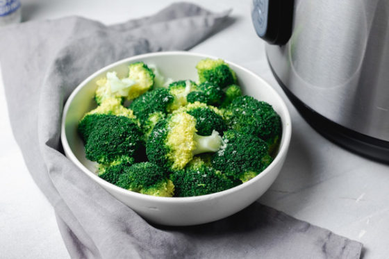 a bowl of steamed broccoli.