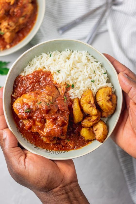 instant pot chicken cacciatore served in a bowl with basmati rice and fried plantain.