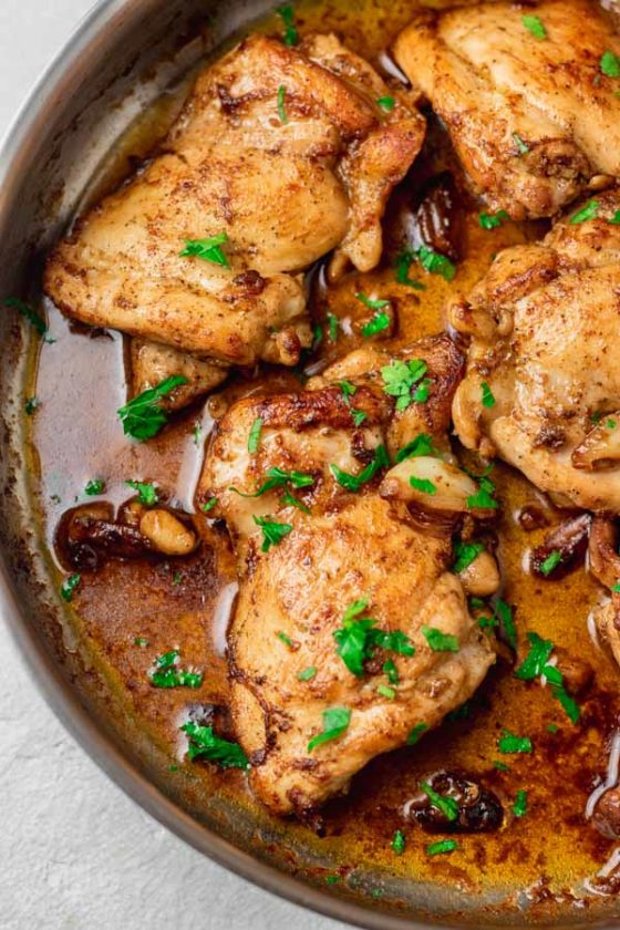 garlic chicken thighs in a pan.