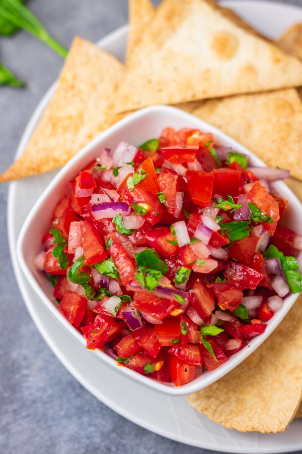 a small bowl of Salsa Fresco served with tortilla chips