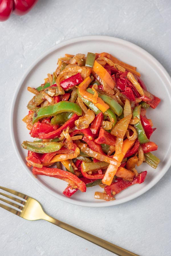 a plate of sauteed peppers and onions.