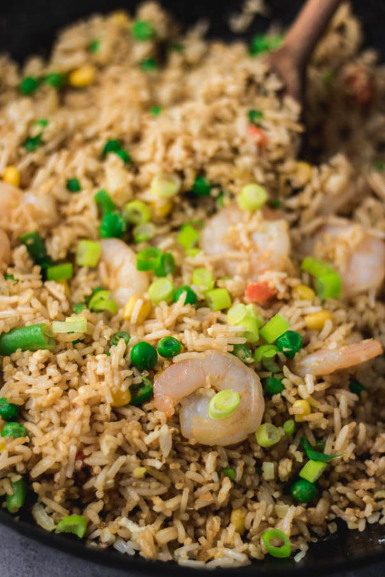 shrimp fried rice in a wok.