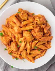 a bowl of chicken penne pasta.