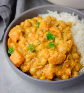 a bowl of sweet potato curry with chickpea.
