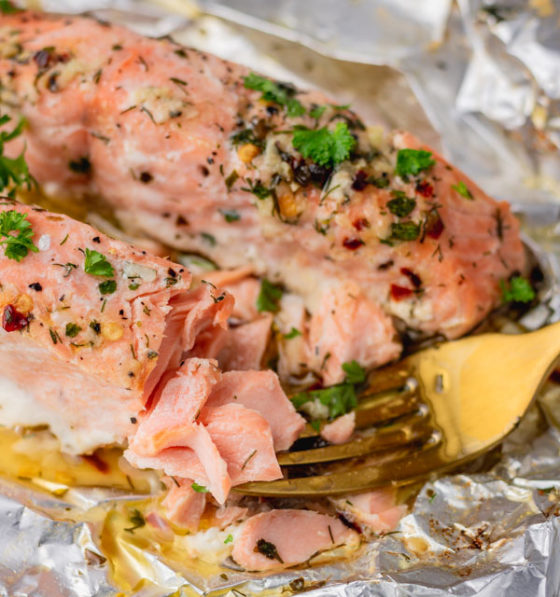 flaked baked salmon on a fork.
