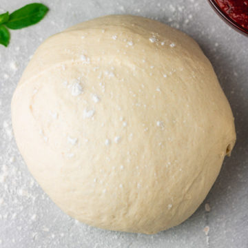 lightly floured pizza dough.