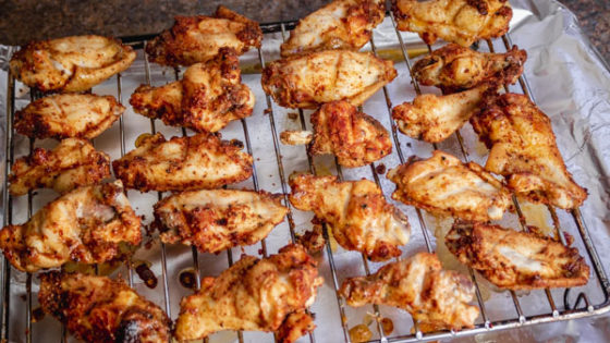 baked chicken wings on a baking rack.