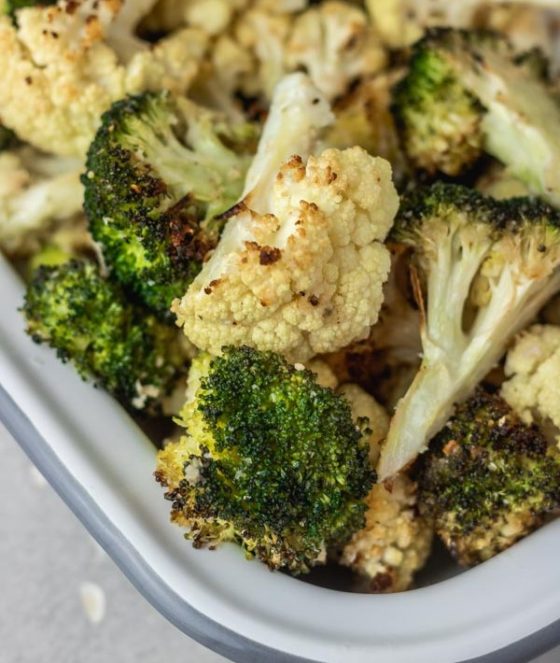 roasted cauliflower and broccoli in a baking dish.
