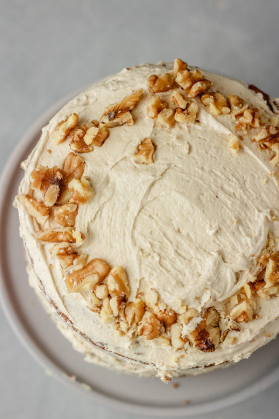 decorated coffee cake with chopped walnuts.