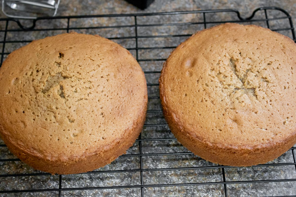 two freshly baked coffee cakes on a cooling rack.