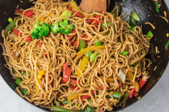 ready vegetable noodles in wok.