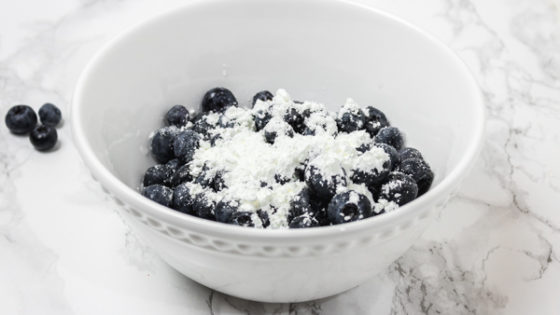 a white bowl of blueberries.