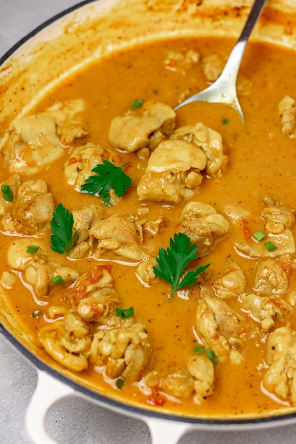 chicken curry in a pan.