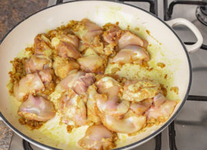 chicken thighs in a pan.