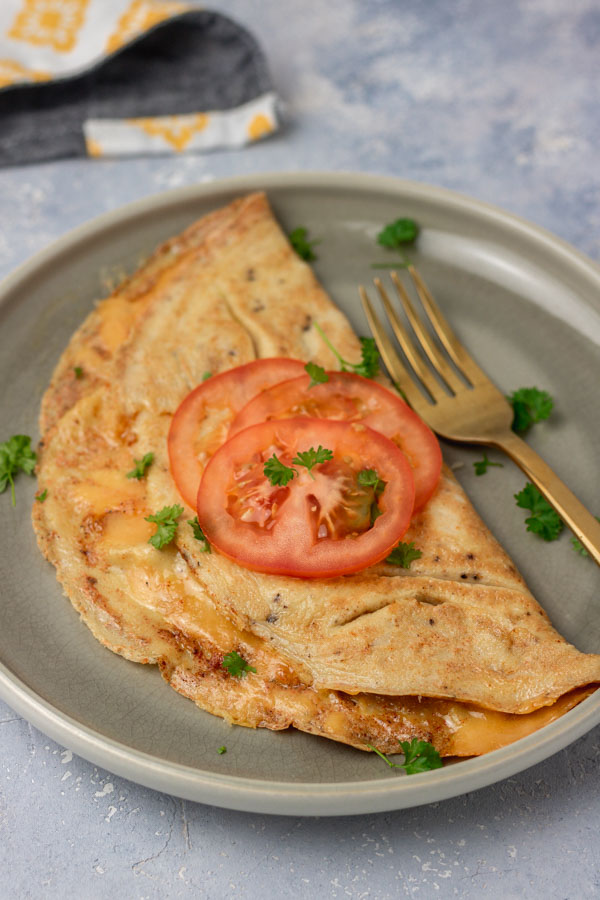omelette topped with tomatoes. 