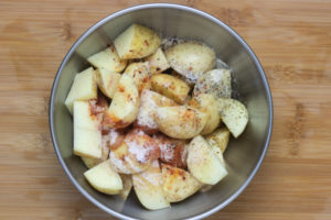 seasoned potatoes in a bowl.