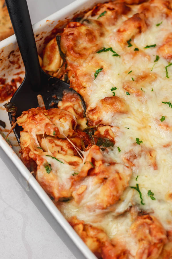 baked pasta with cheese topping in a baking dish.