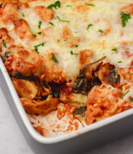 baked tortellini in a baking dish.