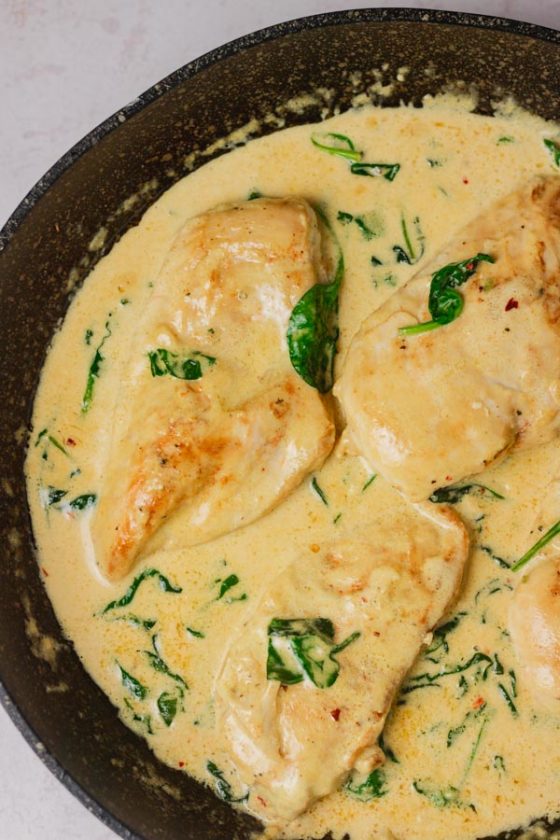 creamy sauce with spinach and chicken breast.