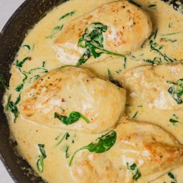 creamy sauce with spinach and chicken breasts.