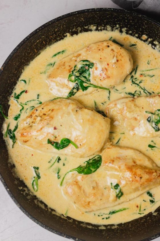 creamy sauce with spinach and chicken breasts.
