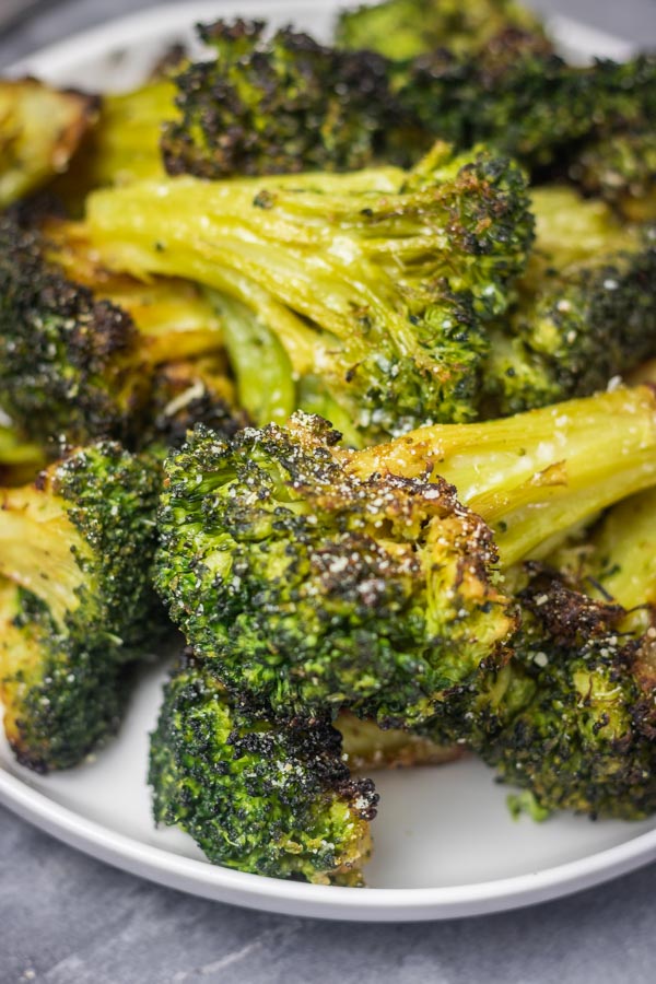 a plate of roasted broccoli.