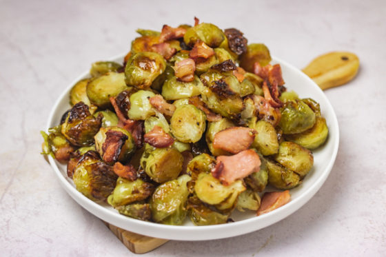 a plate of brussels sprouts and bacon.