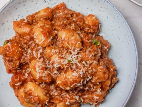 a plate of gnocchi bolognese.