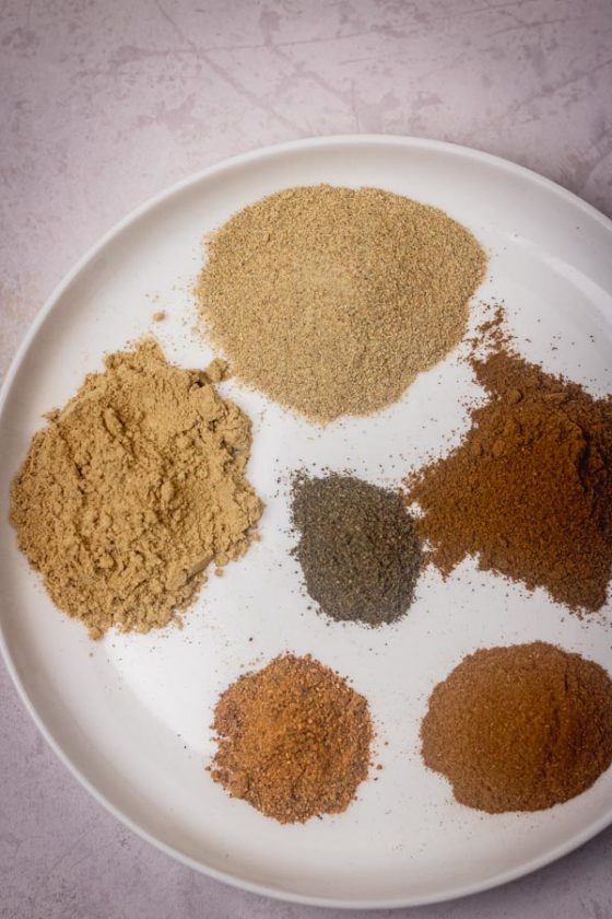individual ground spices on a plate