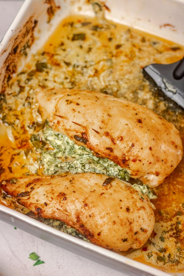 cooked chicken breast in a baking dish.