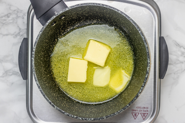 butter melting in a saucepan.