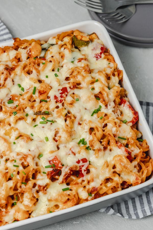 baked pasta garnished with chopped chives.