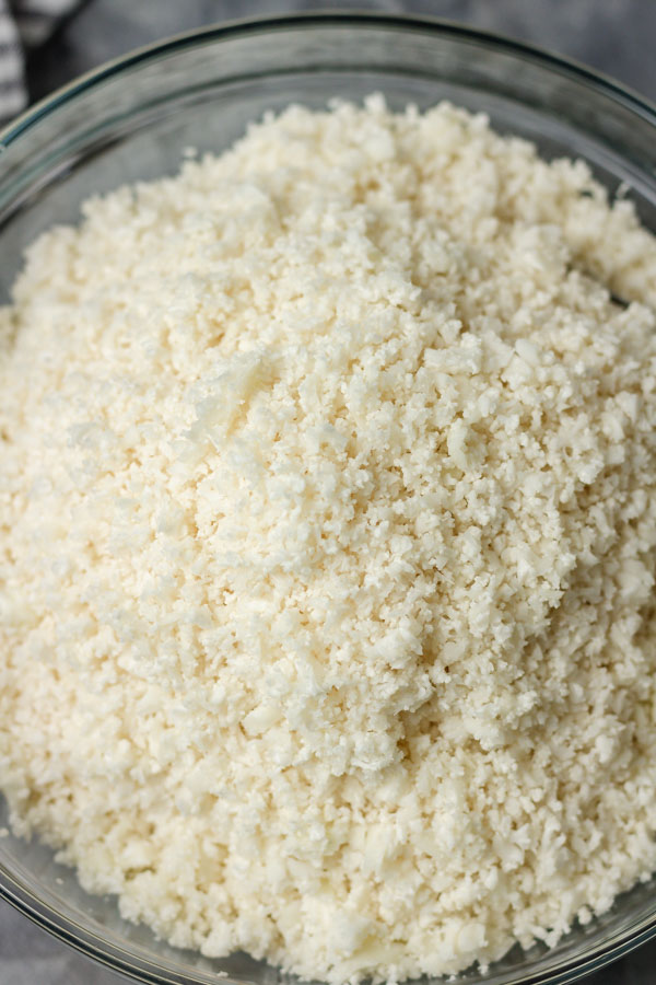 a close shot of cauliflower rice in a bowl.