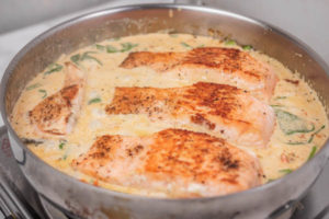 salmon fillets in a creamy sauce.