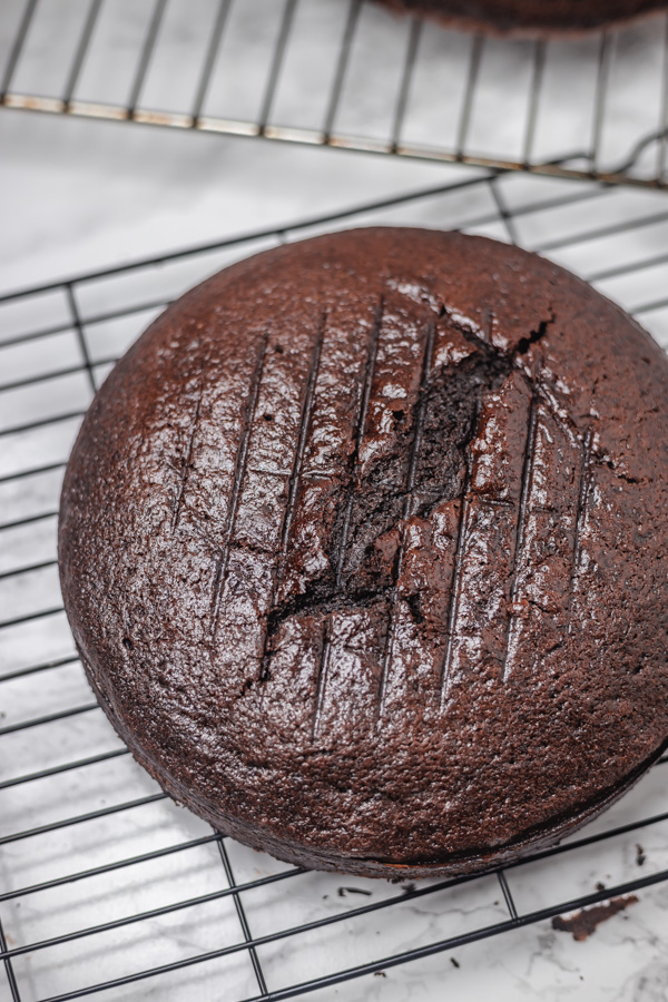chocolate cake on a cooling rack.