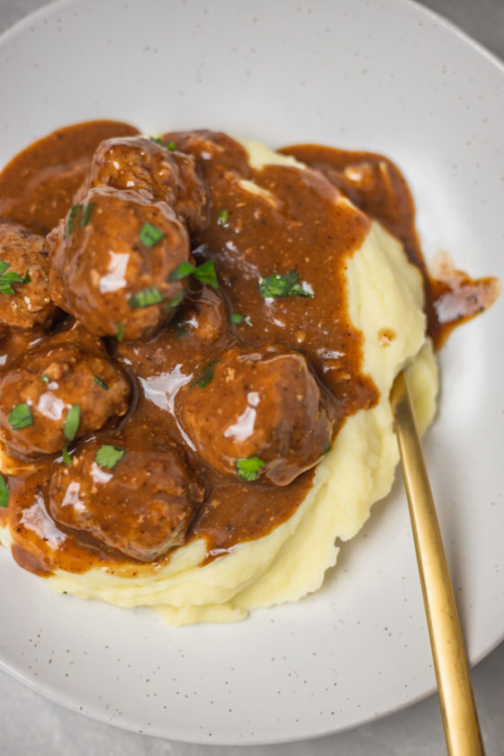 meatballs and gravy over mashed potato.