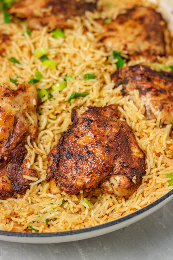 rice and chicken in a pan.
