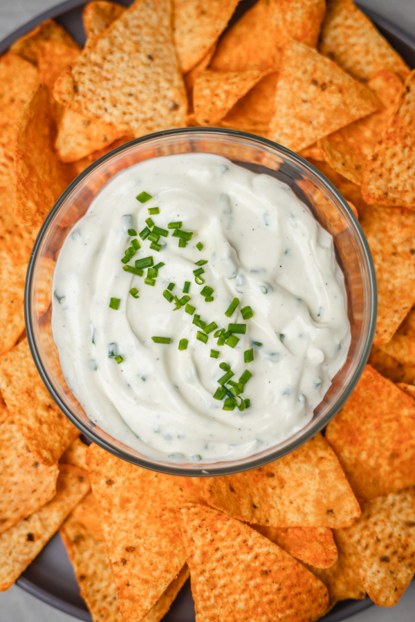 a bowl of dip and chips.