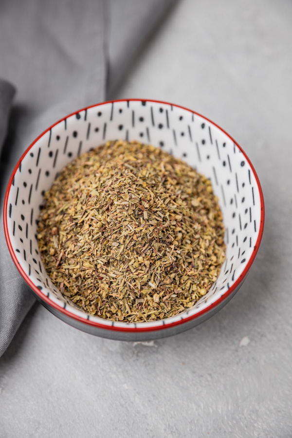 dried herbs in a patterned bowl.
