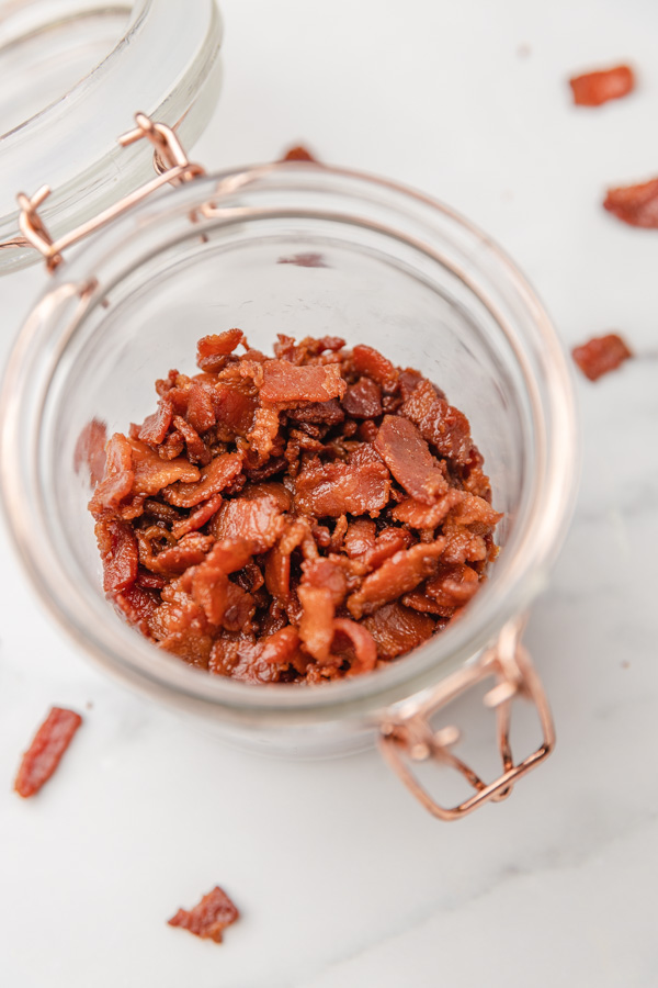 bacon pieces in a glass jar.