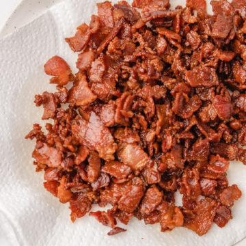 bacon bits on a lined kitchen towel plate.