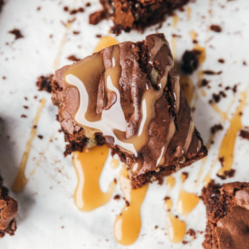 a brownie drizzled with caramel sauce.