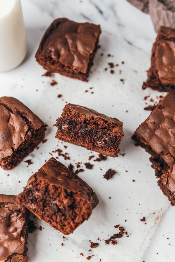 brownie squares on a parchment paper.