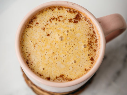 a cup of frothy pumpkin spice milk.